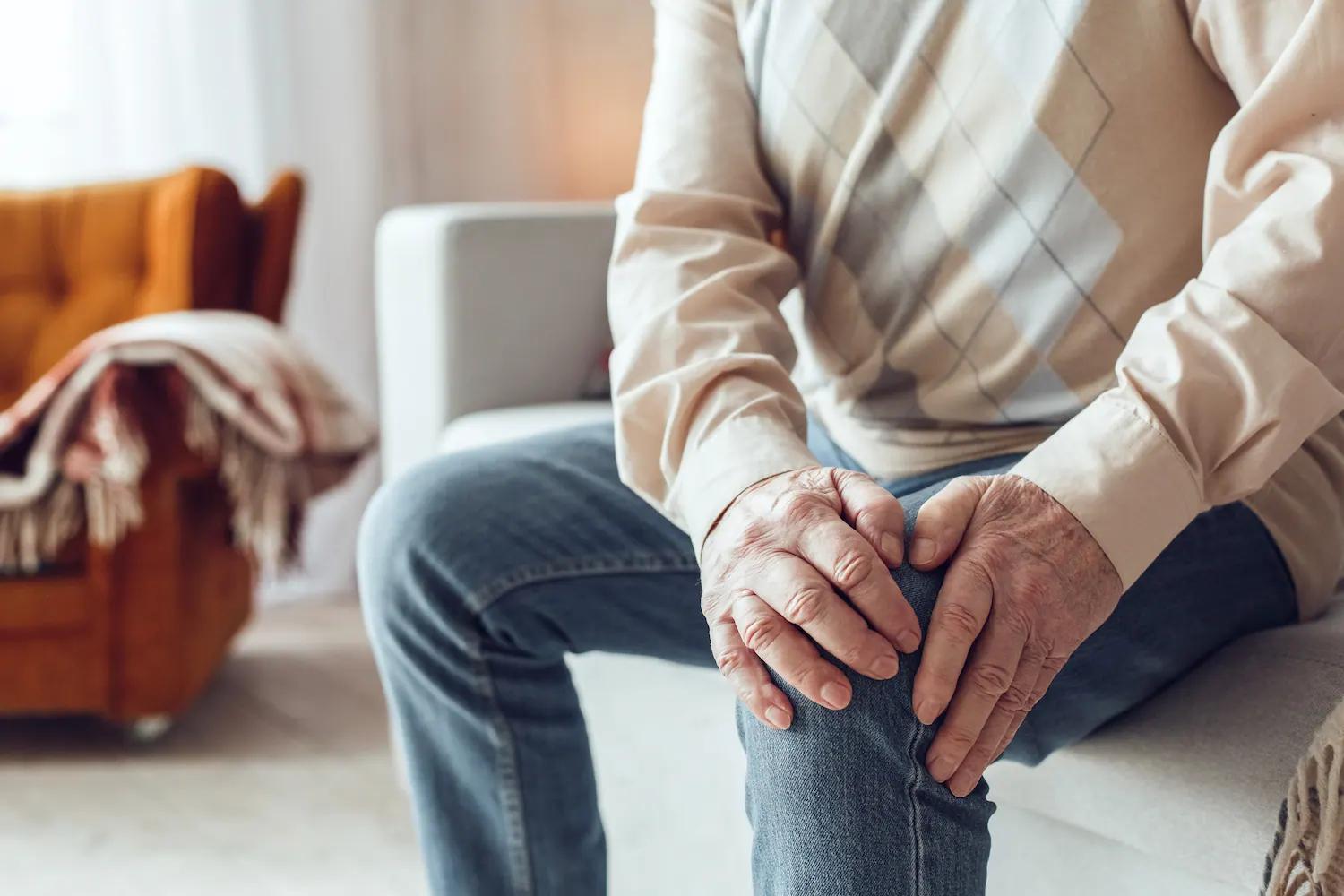 a old man suffering from arthritis