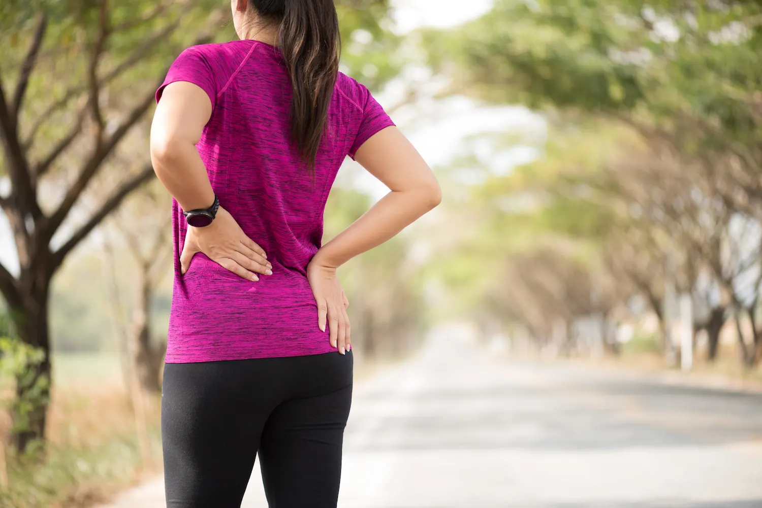 a woman having a herniated disc pain
