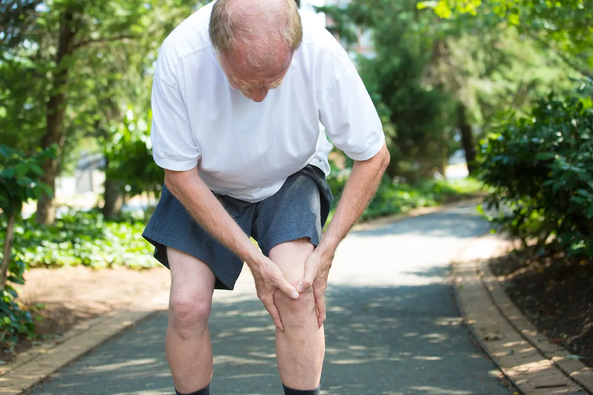 old man suffering from bursitis