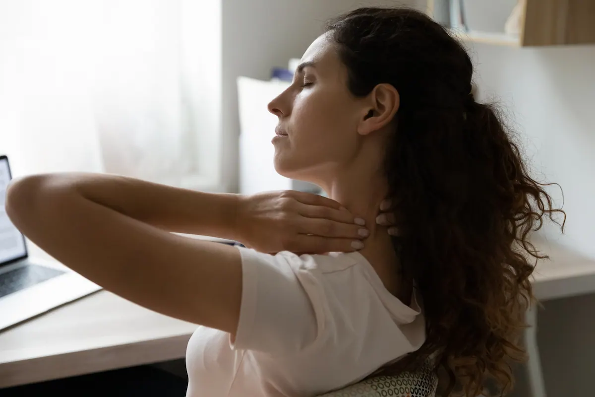 a woman having a neck pain