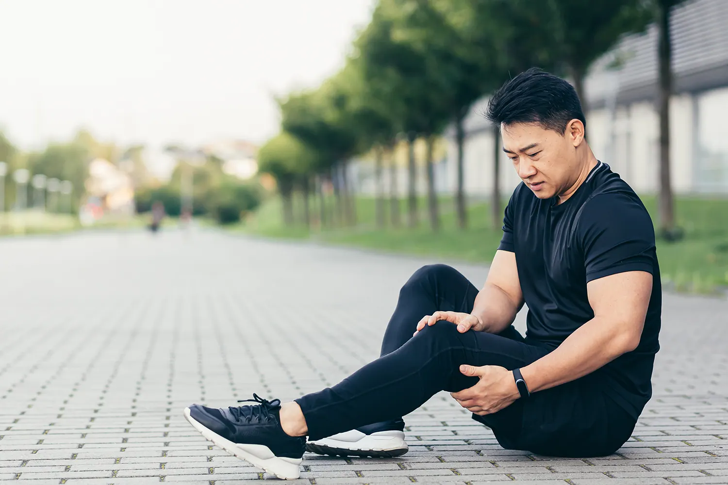 a man suffering from leg pain after walking