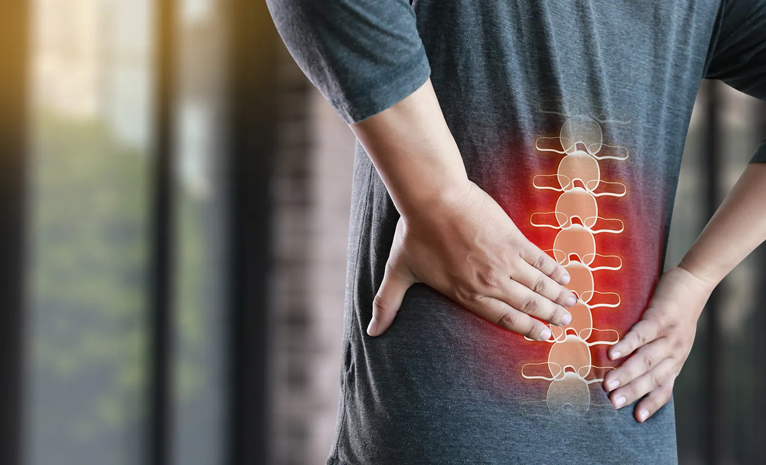 a man touch his pinched nerve pain