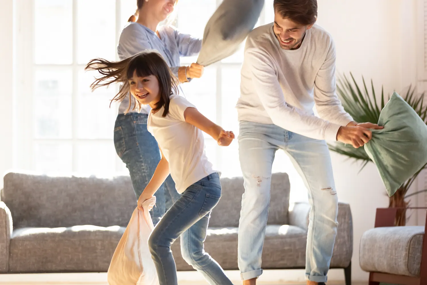 a family having a pillow fight
