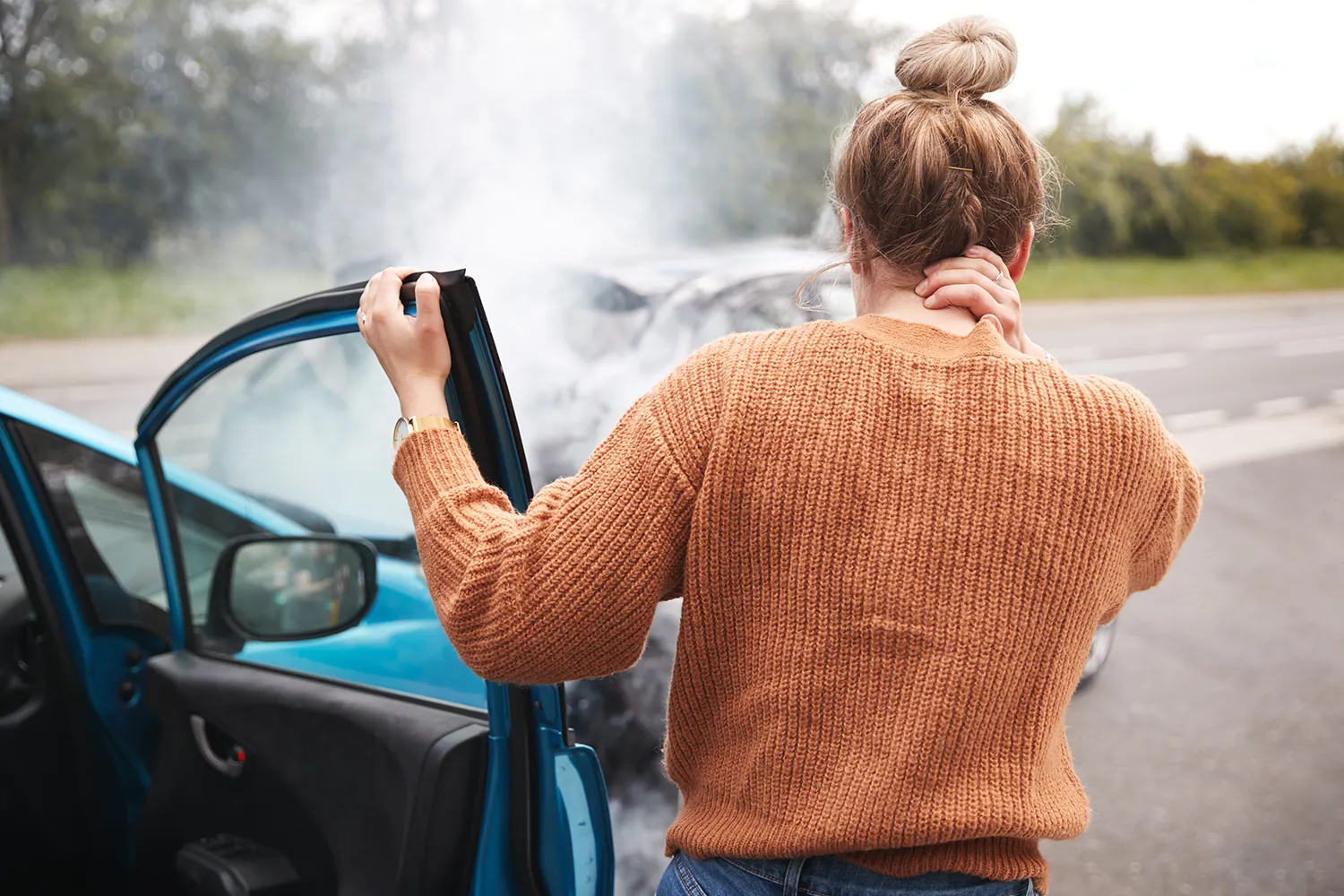 a woman suffering from whiplash after the accident
