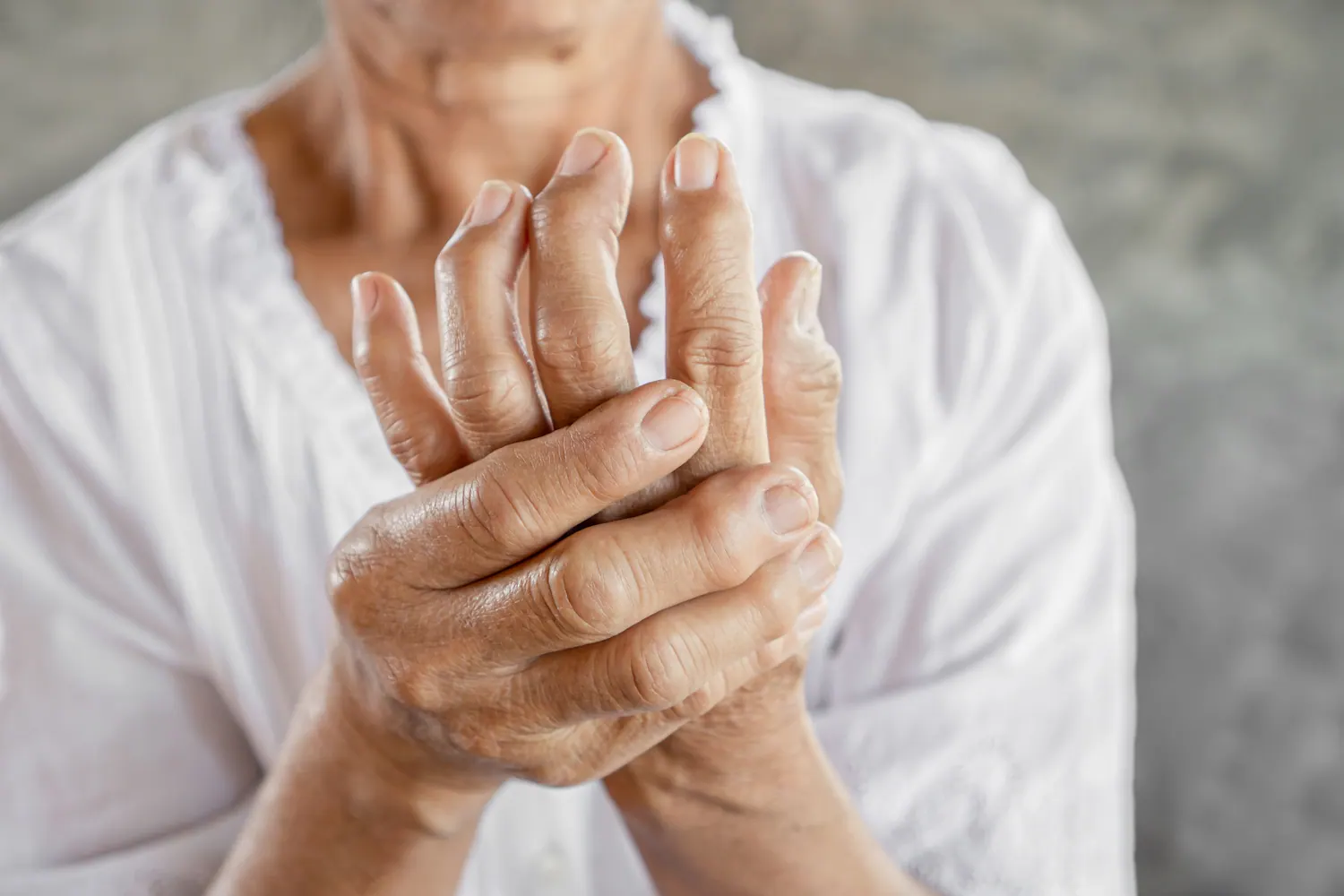 a old woman suffering from arthritis