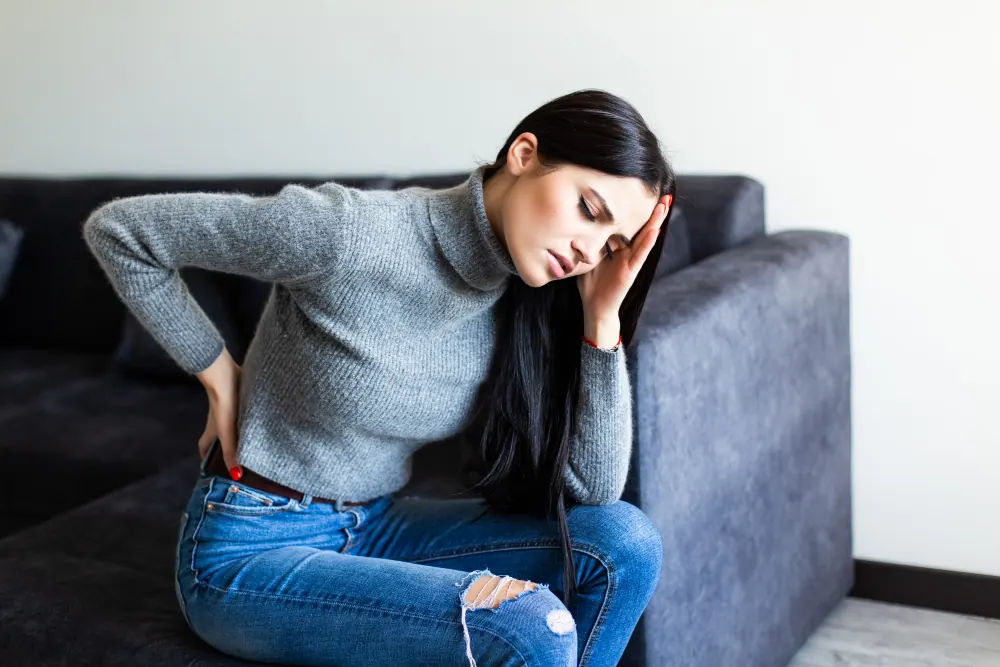 a woman suffering from spinal decompression pain
