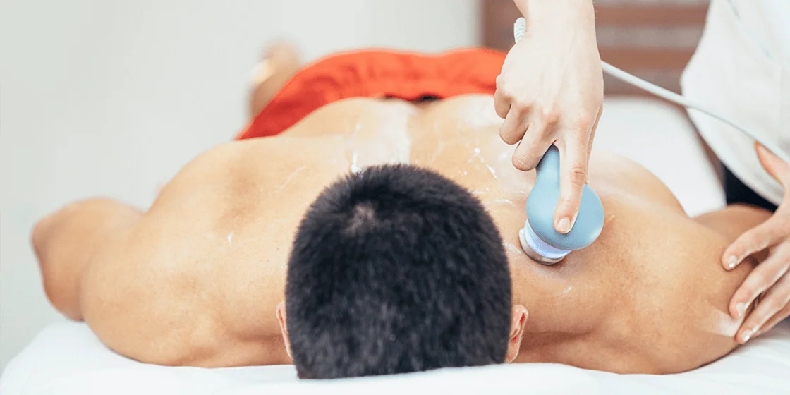 a man having ultrasound in his back