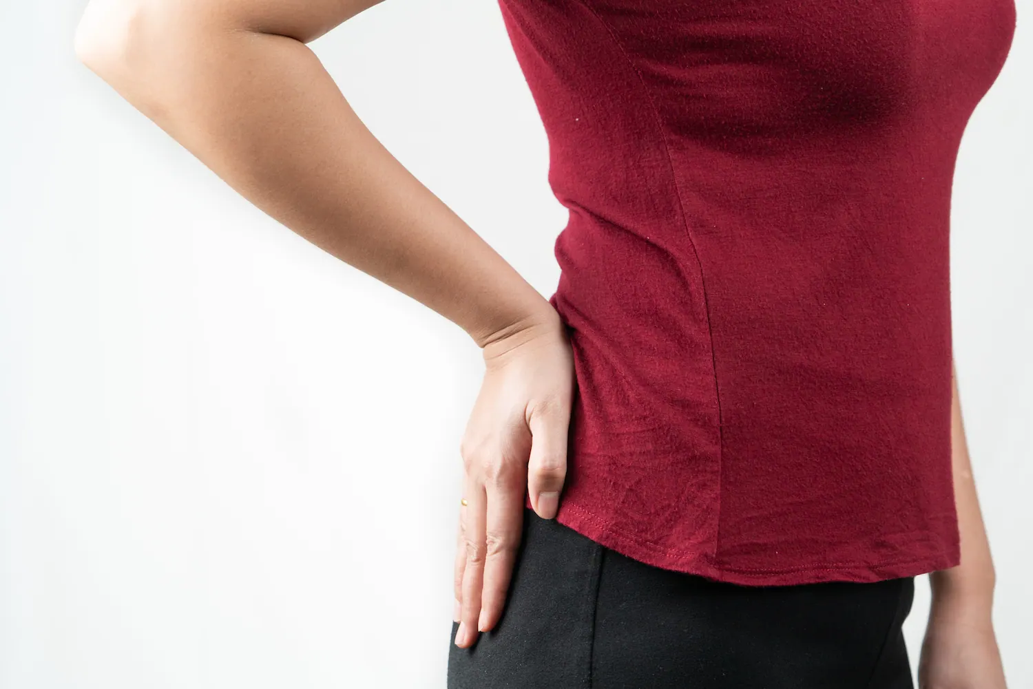 a woman touch her hip pain