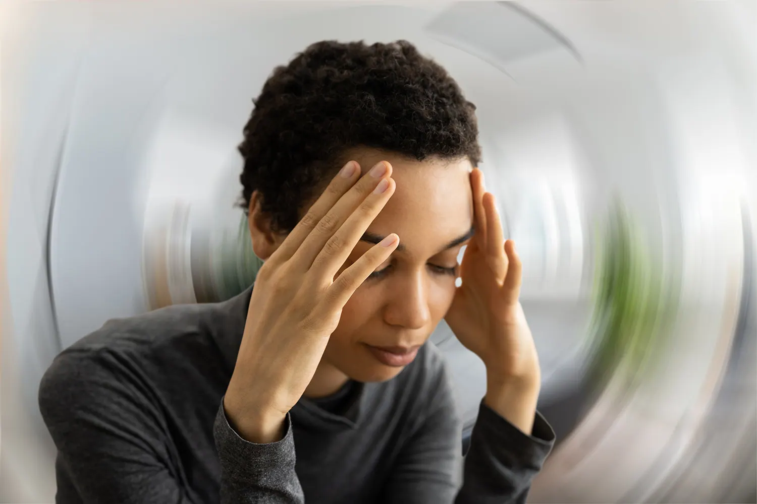asian woman suffering from vertigo pain